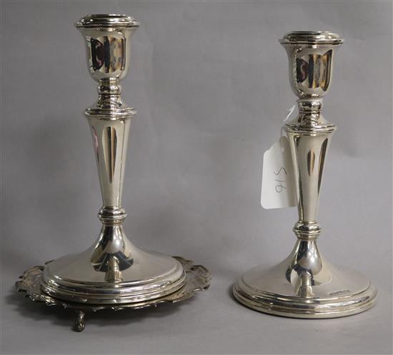 A pair of modern silver candlesticks by Carrs of Sheffield and a similar silver waiter, candlesticks 20.4cm.